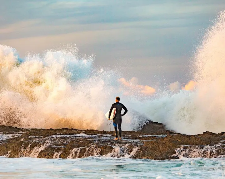 Surfer between twin spray