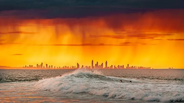 Skyline and a breaking wave